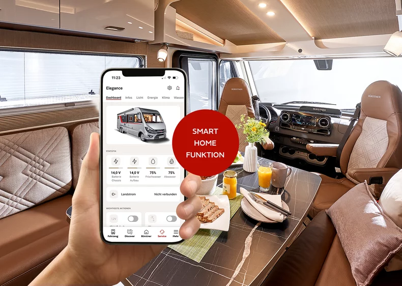 Innenansicht eines Bürstner Wohnmobils mit Smartphone, das eine Smart-Home-App zeigt.