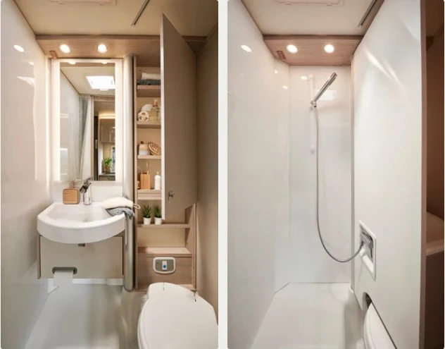 Ein modernes Wohnmobil-Badezimmer mit Waschbecken, Spiegel und Dusche.