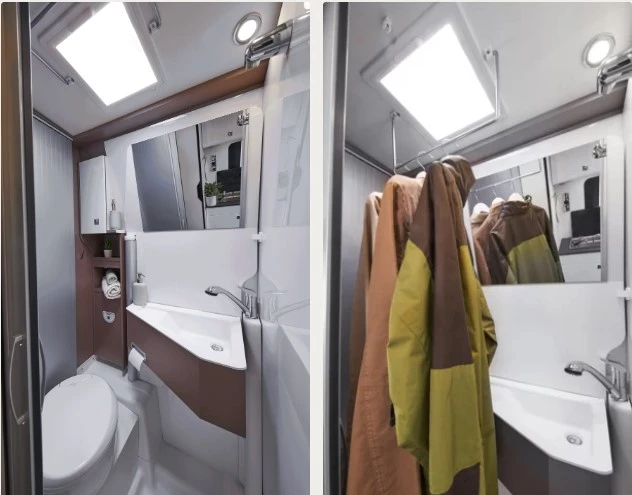 Ein kompaktes Badezimmer in einem Wohnmobil mit Toilette, Waschbecken und Spiegel.